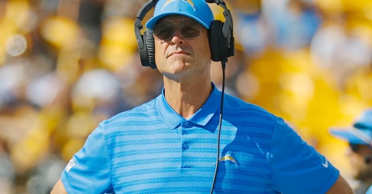 Harbaugh conoce a Elliott del futbol colegial